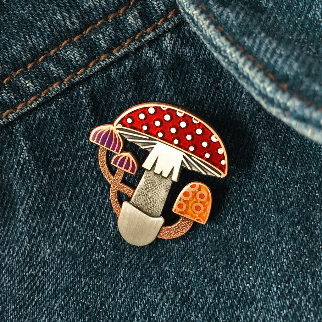 Mycelia mushroom enamel pin seconds in antique copper and silver. With translucent red, purple and orange enamel.